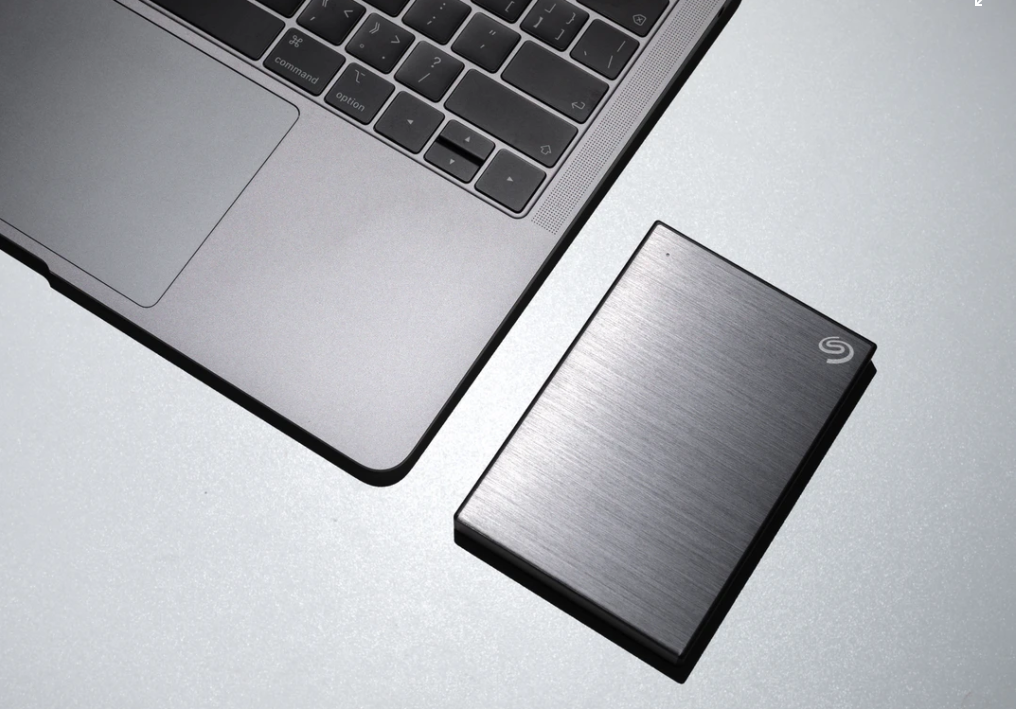 Close Up of an Apple Laptop and Hard Drive